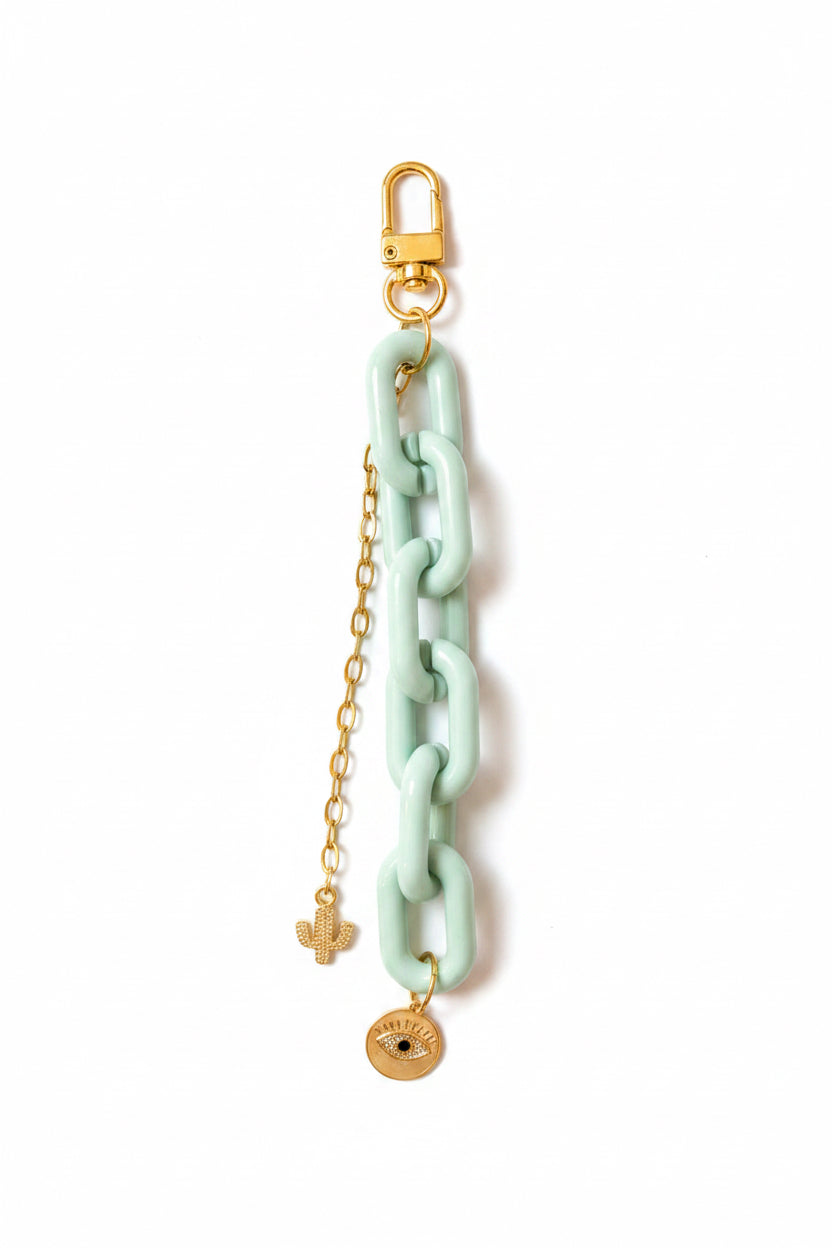 Mint green resin and gold bag charm